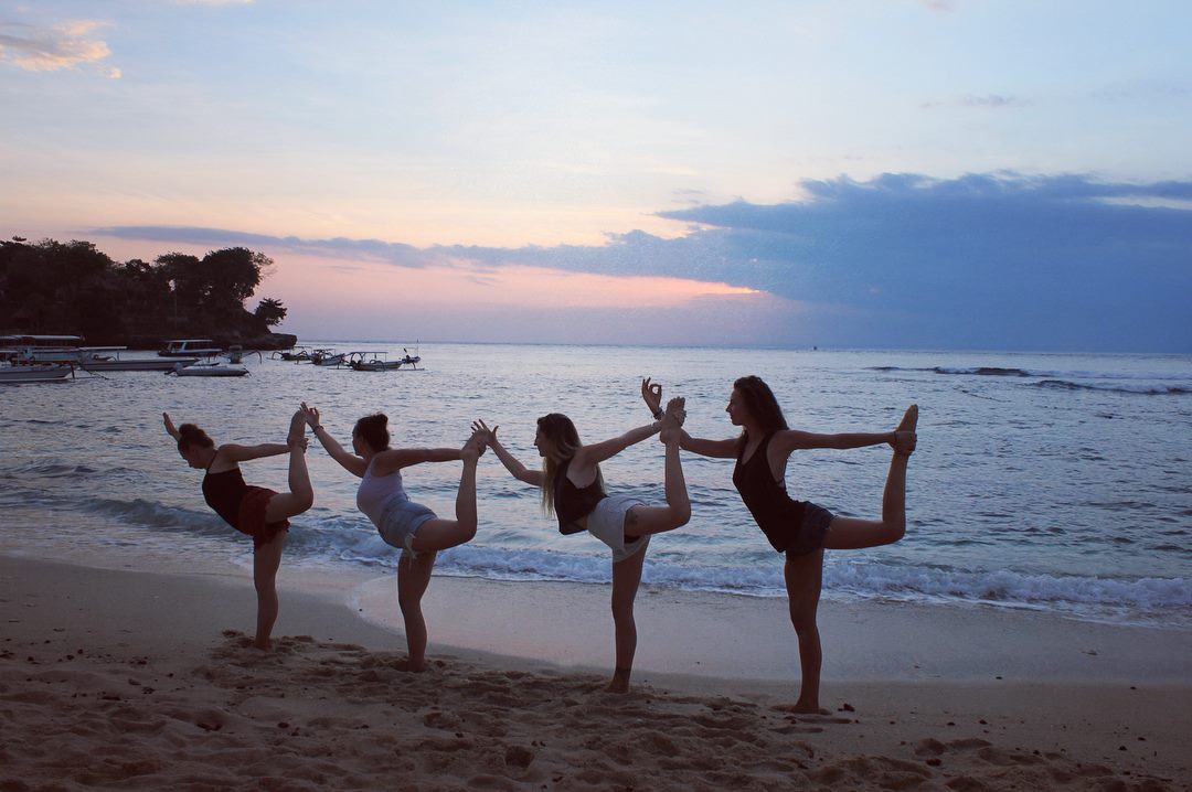 santosha yoga teacher training students on beach