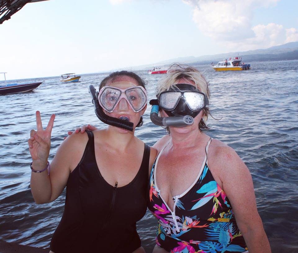 santosha yoga teacher training students on boat with snorkels