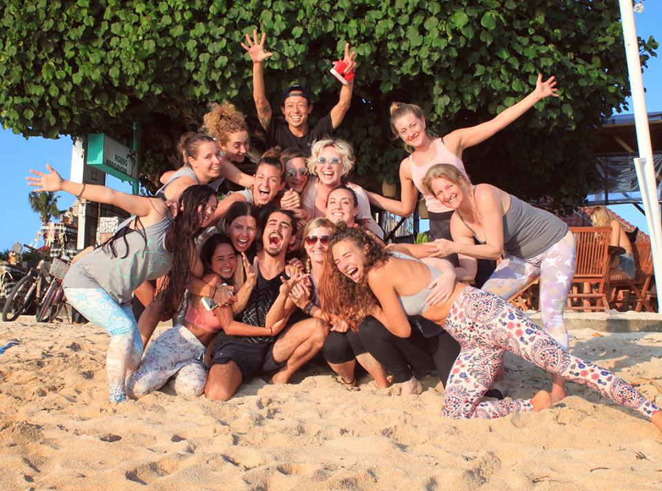 santosha yoga teacher training students on beach being silly