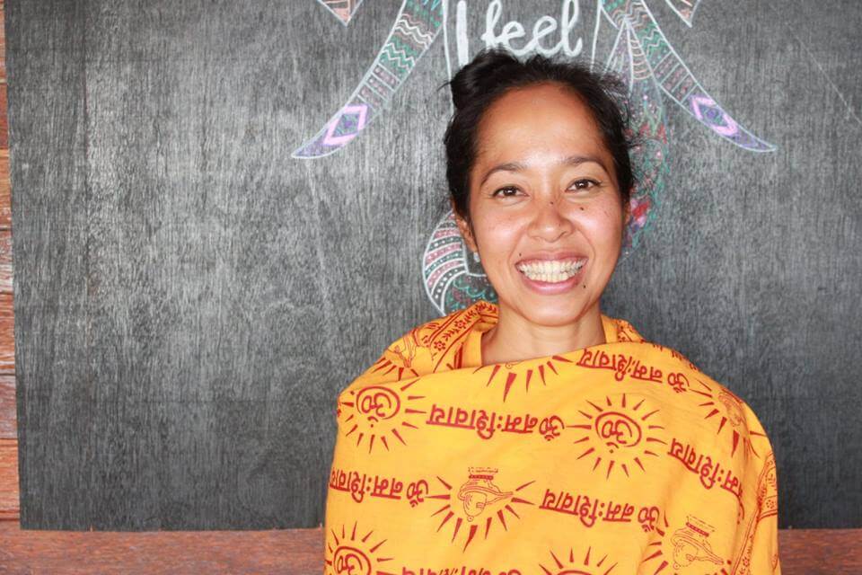 santosha yoga teacher training teacher smiling
