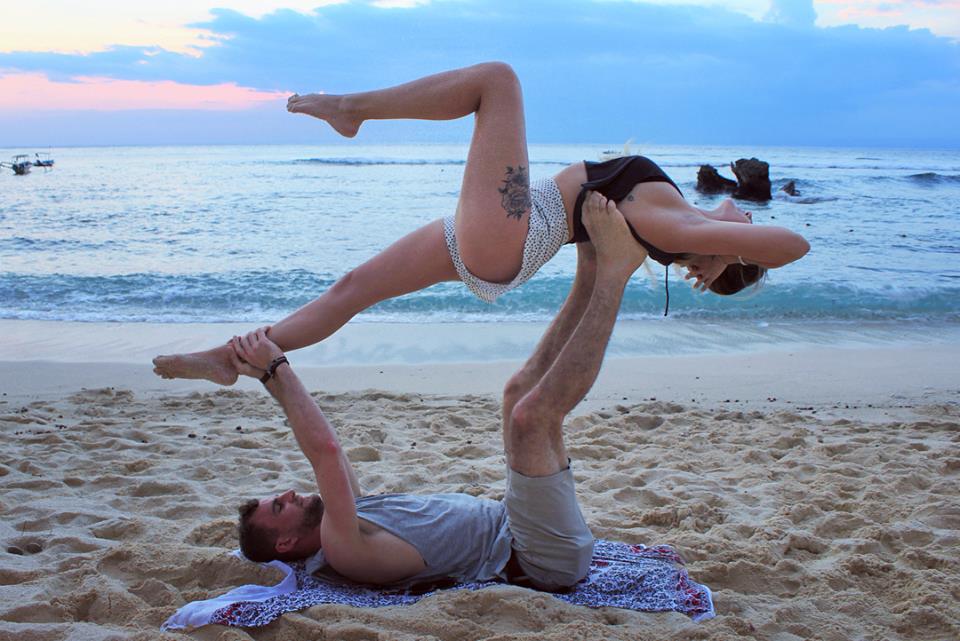 two santosha yoga teacher training students yoga on beach